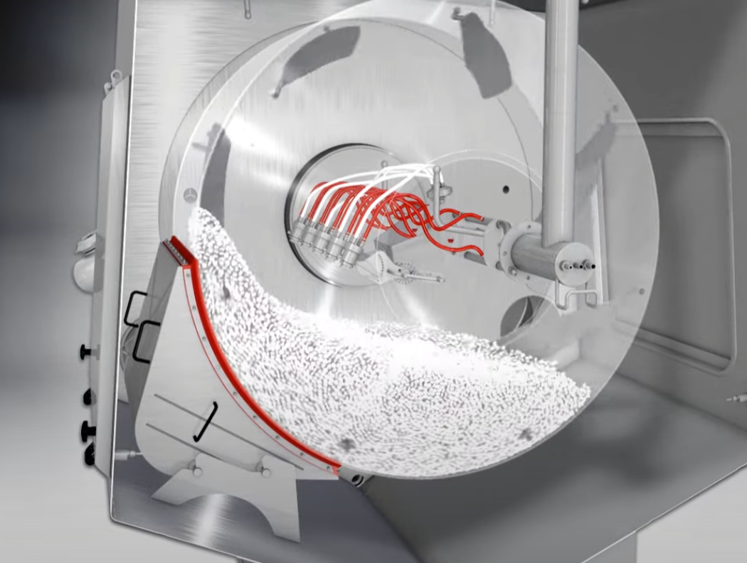 The drum starts to rotate the uncoated tablets