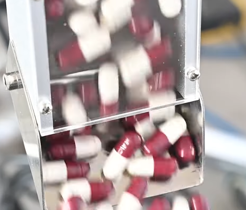 Feeding capsules to the polishing chamber