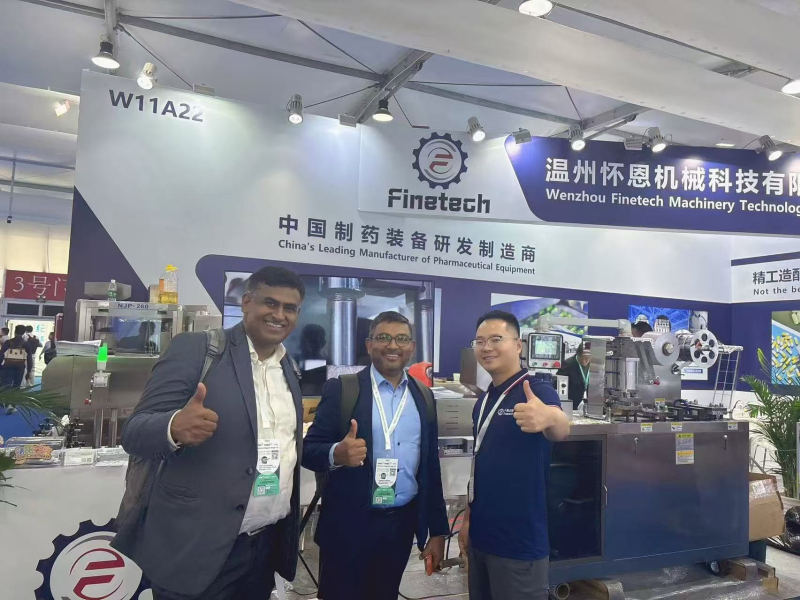 Report on Finetech's Participation in The 2026 Shanghai CPHI Exhibition 2 Group photo of Sales Manager Tony Tao with Indian clients
