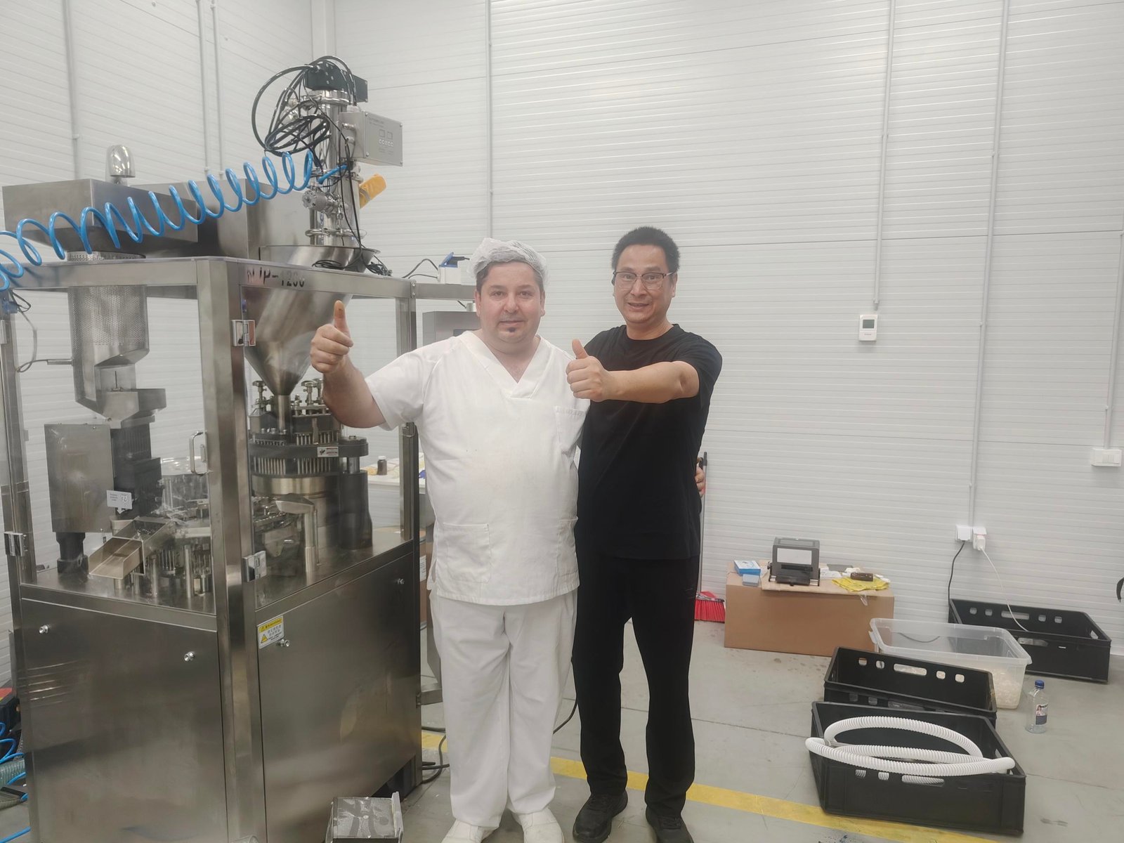 Finetech Technical Director & Romanian Client Posing Beside NJP-1200 Capsule Filling Machine