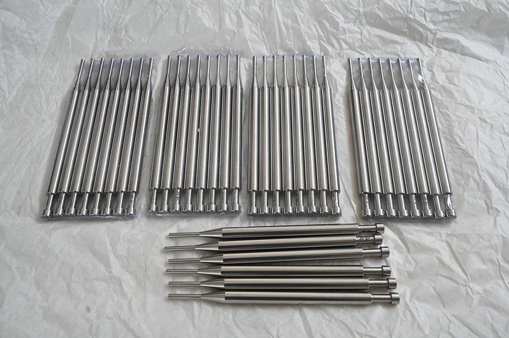 Tamping pins