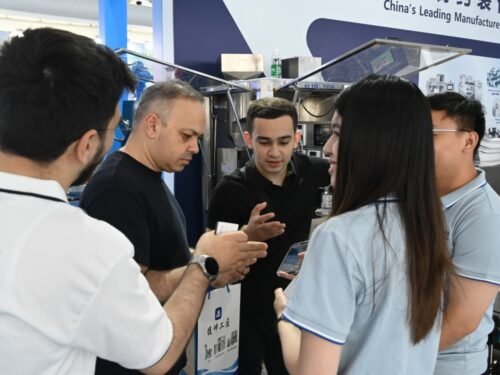 The Azerbaijan‑based client takes a group photo with Finetech sales representative Bella